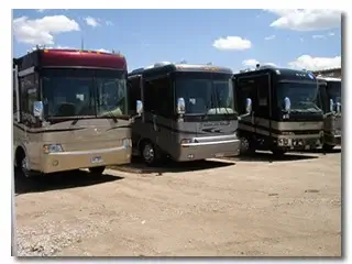 Three Class A motorhomes parked
