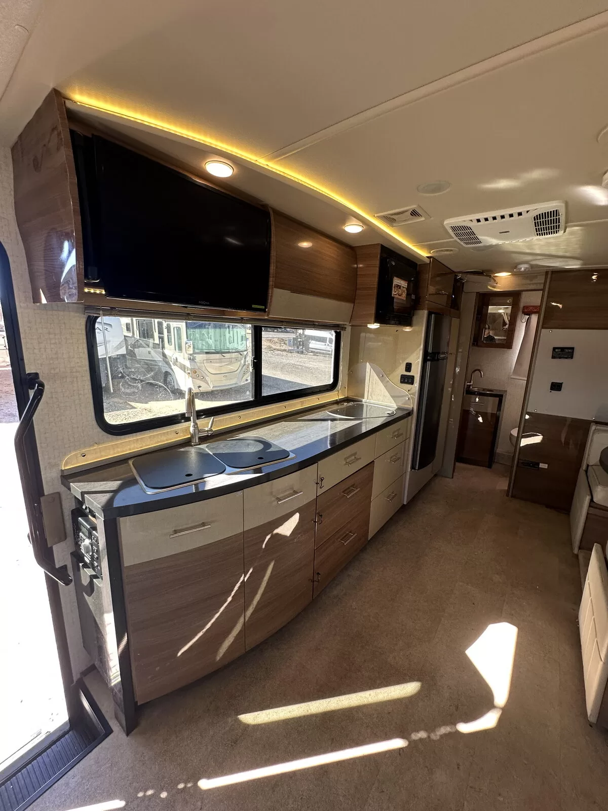2015 Winnebago 24M Class B+ cockpit and driver area at All Star Rv in Littleton, CO
