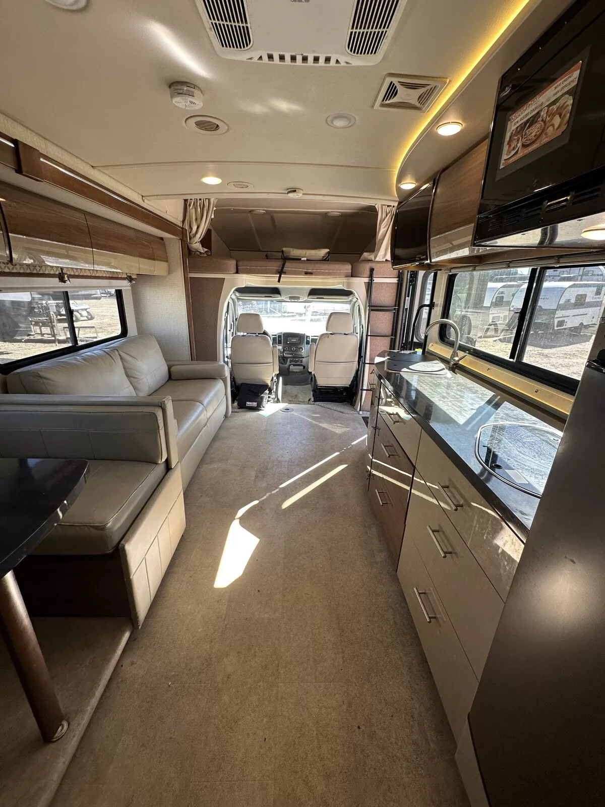 2015 Winnebago 24M Class B+ rear lounge at All Star Rv in Littleton, CO