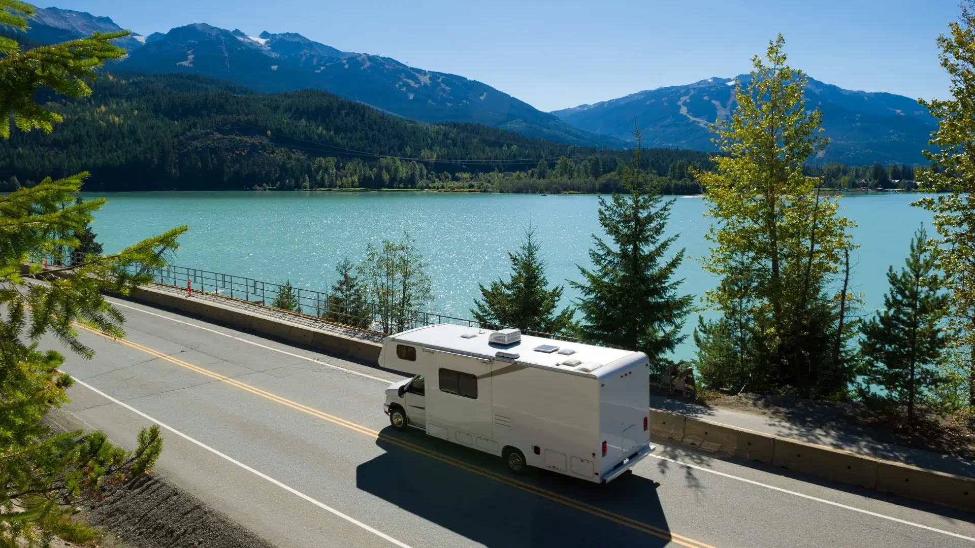 RV driving down a highway with beautiful view