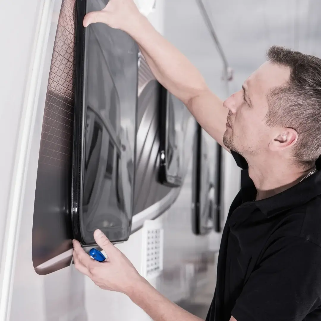 Man performing maintenance on an RV