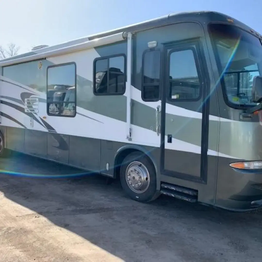 Green and white Class A RV